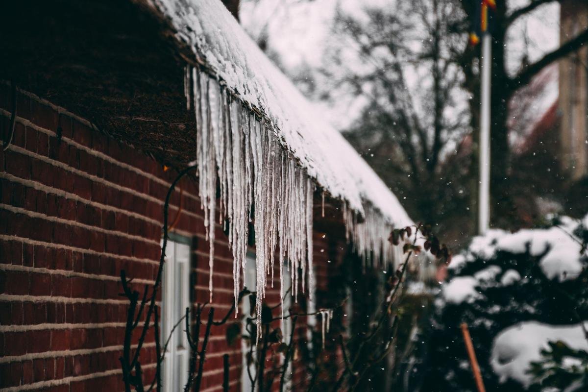Icicles hanging from an Ontario roof edge in winter